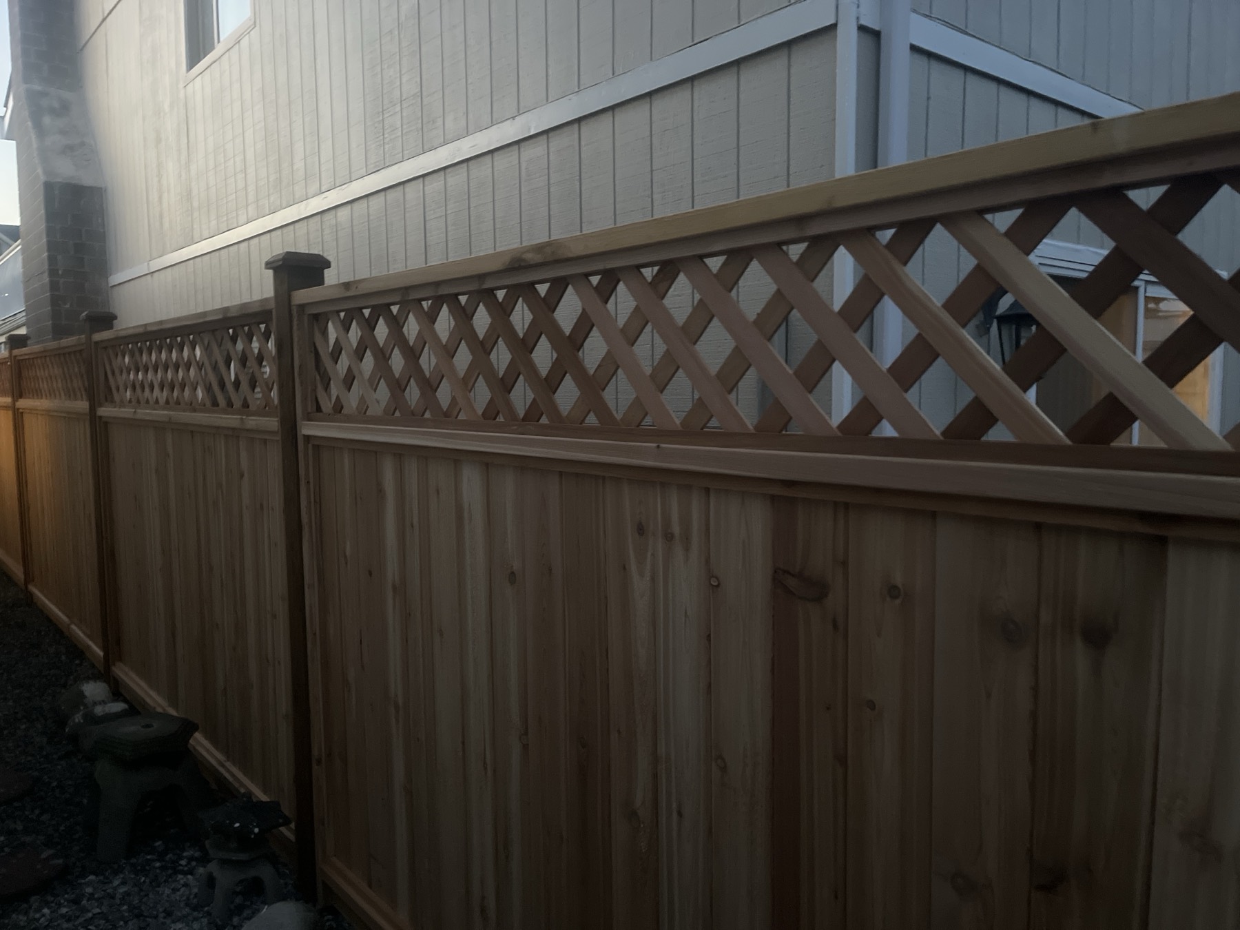 A lattice topped cedar fence