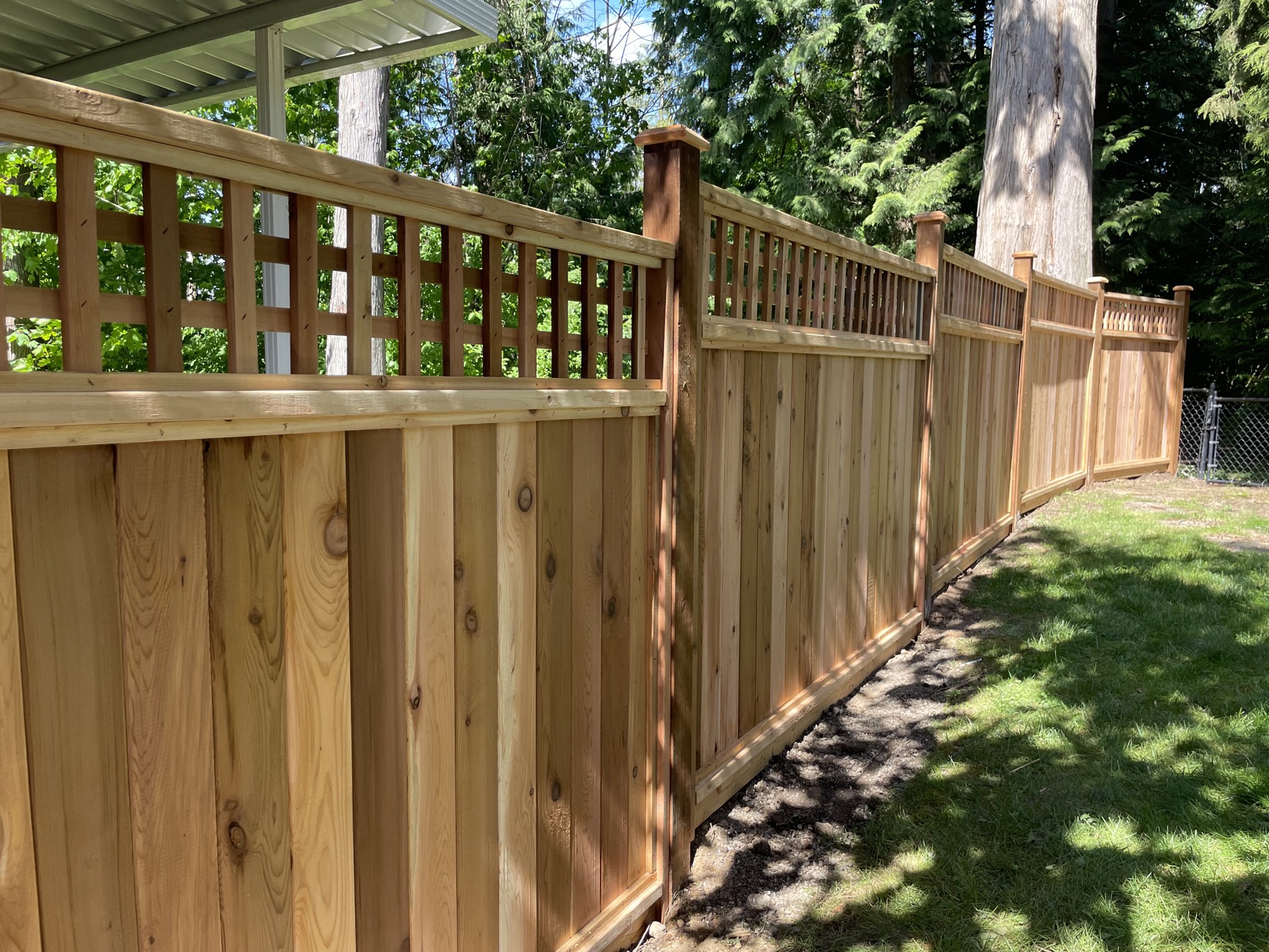 A hand-built cedar fence by M&M Cedar Fencing