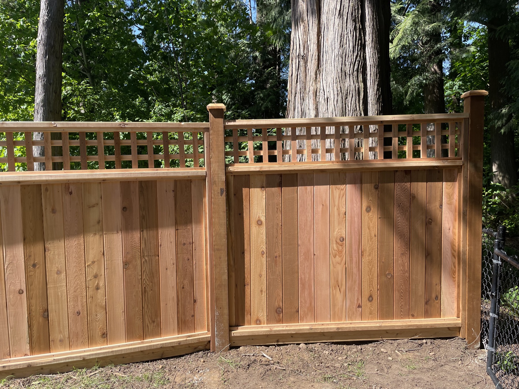 Cedar fence detail with a post and cap